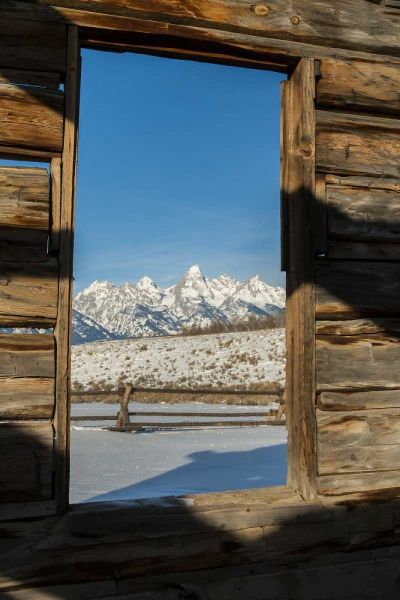 WY, Grand Tetons Mountains through cabin doorway